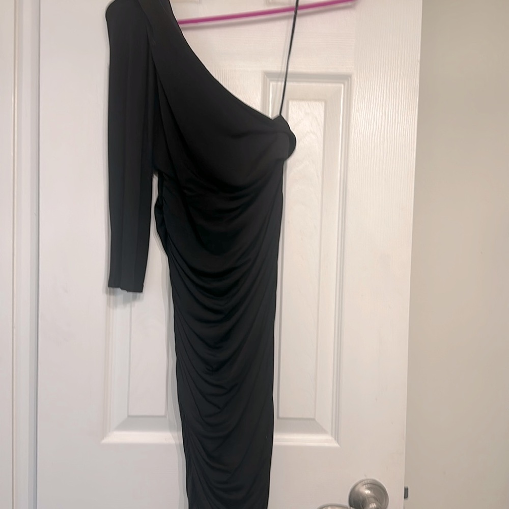 Asymmetrical, black, pleaded short and sexy evening dress. Size small